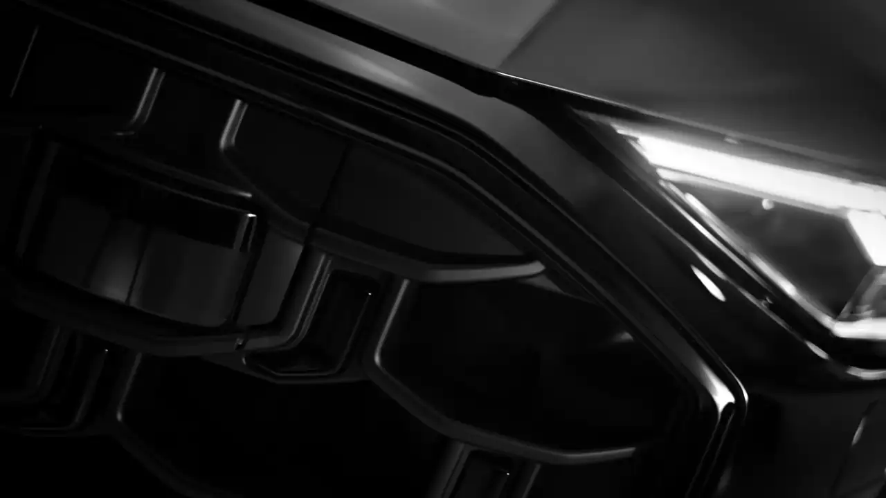 Audi Q8 edition one launch film: a headlight in a dark studio