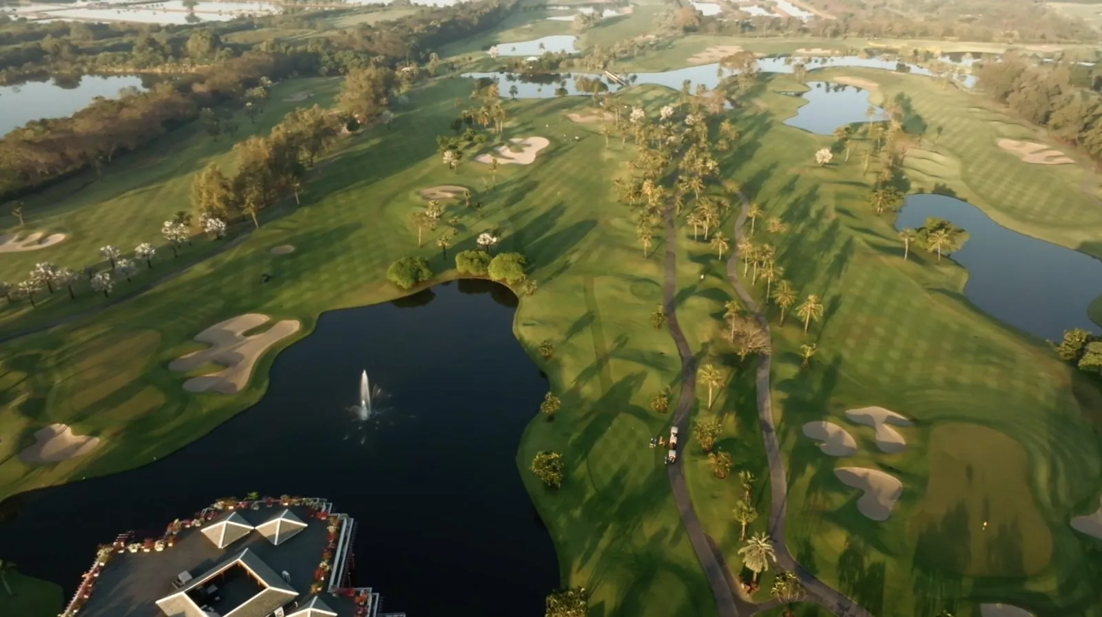 Aerial view of a golf course with water hazards